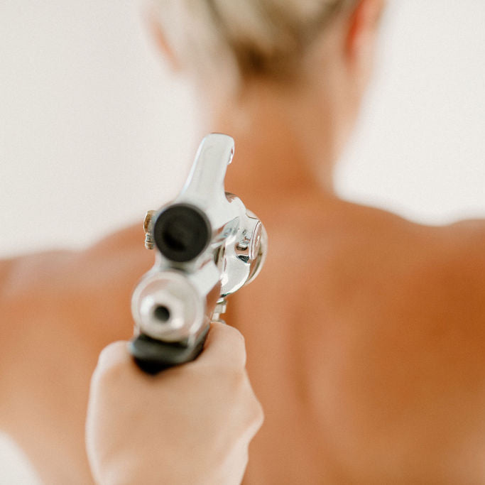 Person holding a hair removal device against their skin